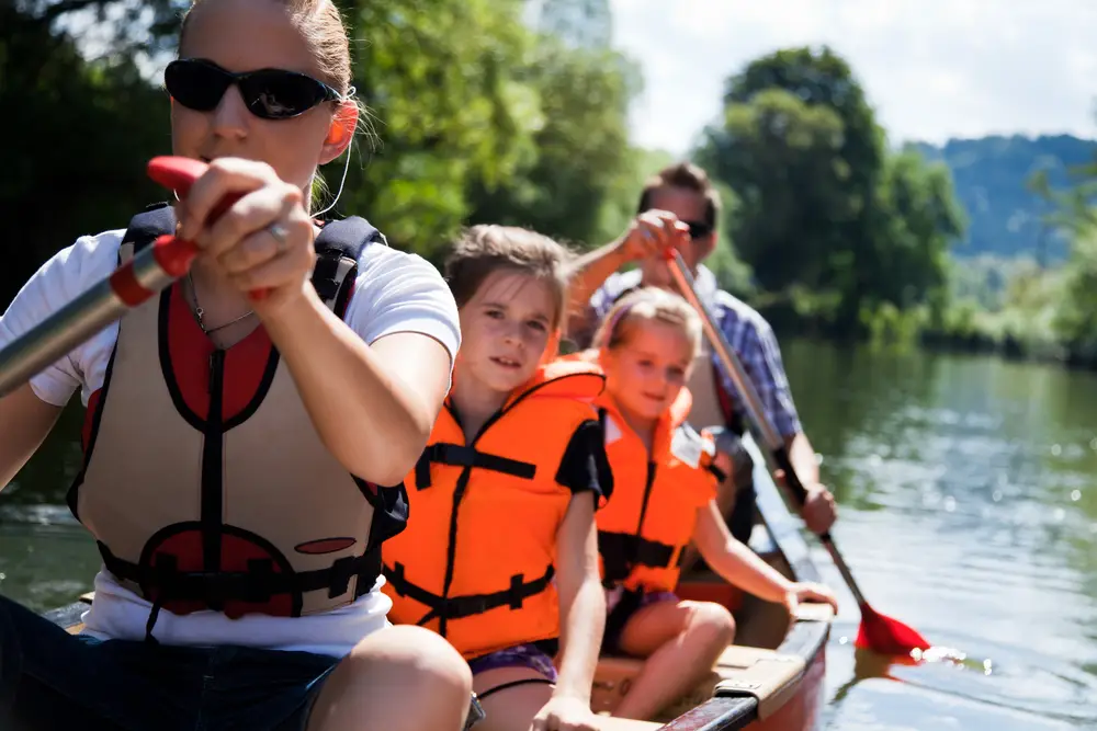 a group of people in a canoe