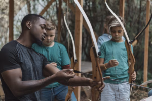 coaching a children's archery team